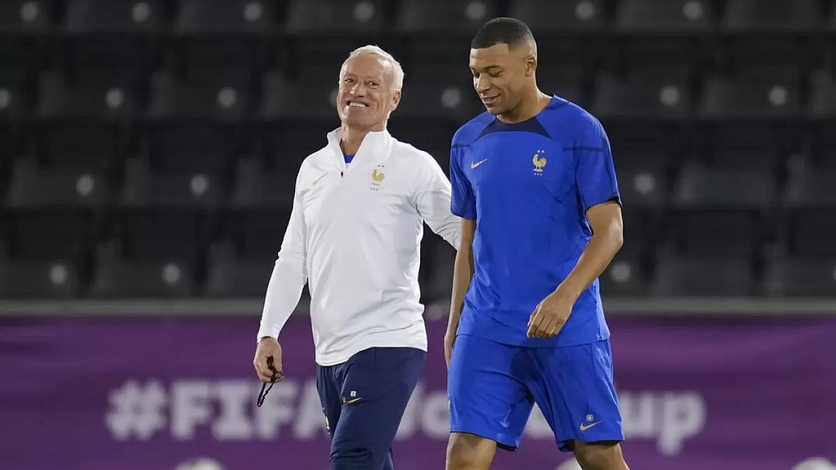 France coach Didier Deschamps, left, arrives for a team training session with Mbappe.