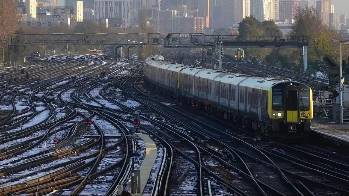  File photo of a train arriving a platform at Clapham Junction station in London, on Dec. 14, 2022.