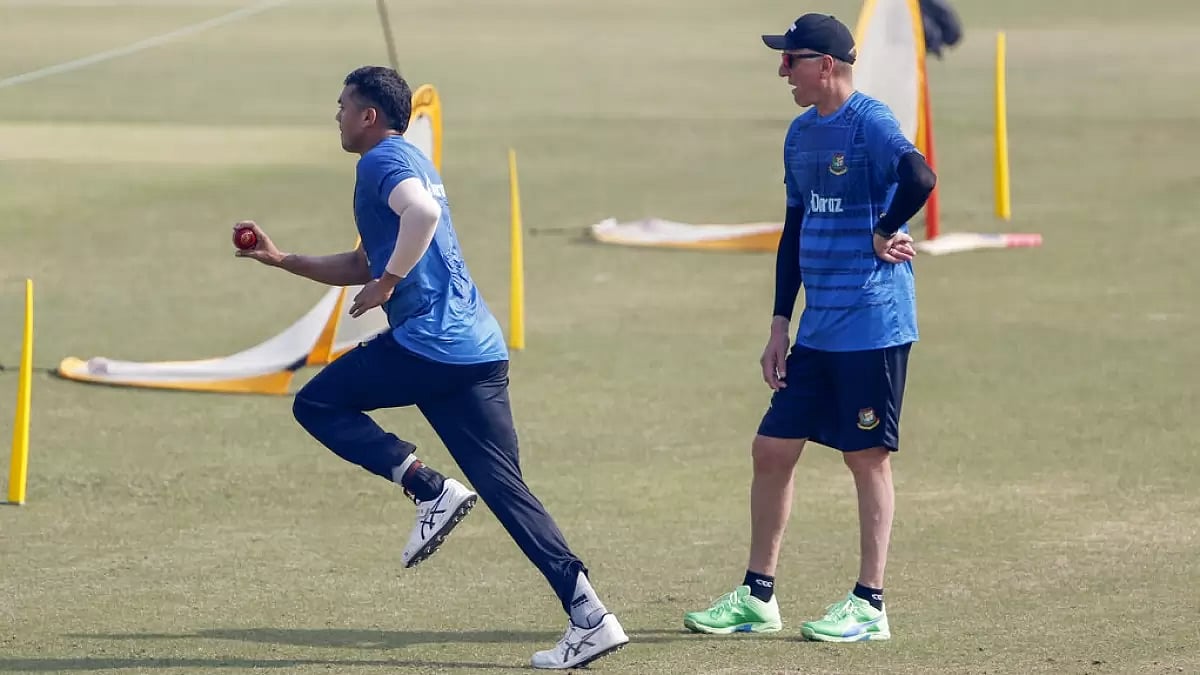 Bangladesh bowling coach Allan Donald watches as Taskin Ahmed runs in to bowl.
