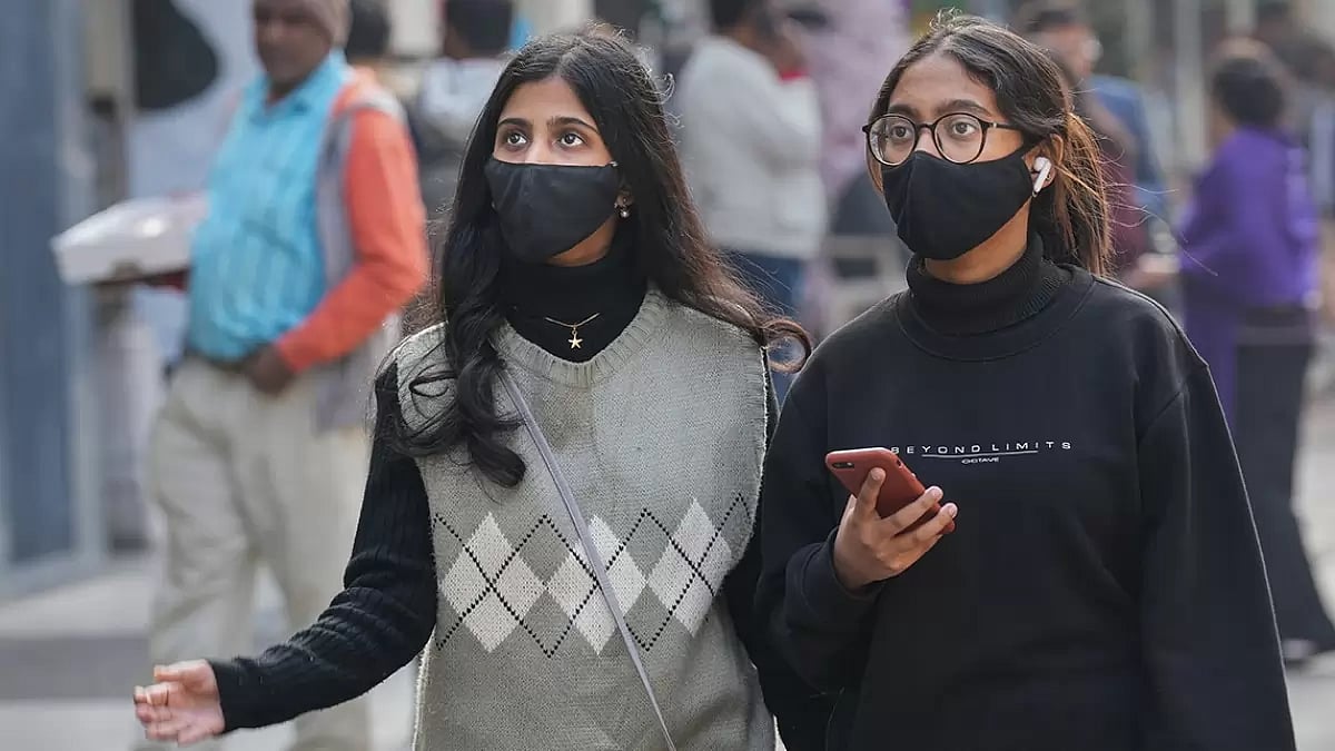 People wear face mask at Khan Market