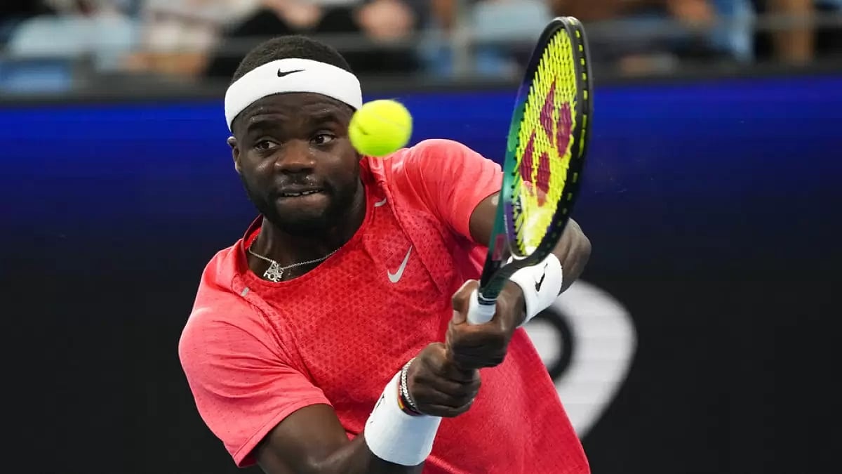 Tiafoe returns a backhand against Tomas Machac in their United Cup match on Friday.