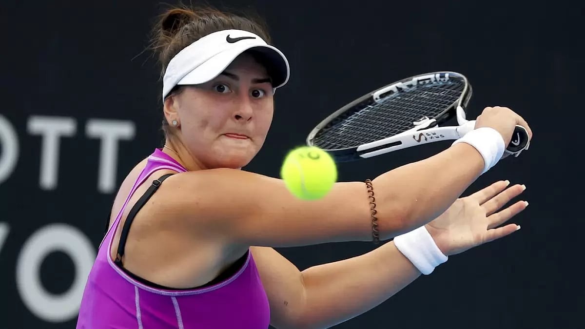 Andreescu makes a backhand return against Muguruza at the Adelaide International on Sunday.