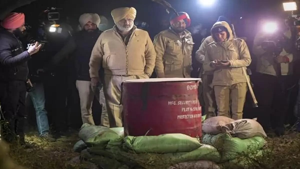 Senior police personnel inspecting the bomb shell near CM Bhagwant Mann's house