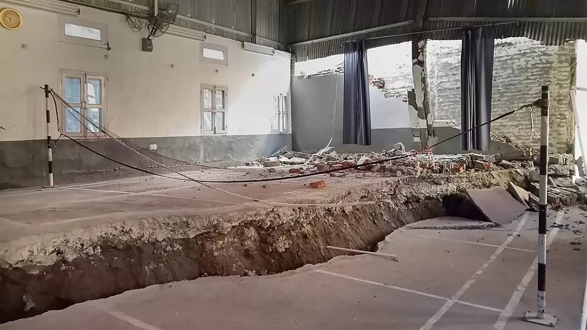 Cracks appear at an indoor badminton court in Joshimath area of Chamoli district. The town has been declared a disaster-prone area after large cracks appeared in homes and on roads. 