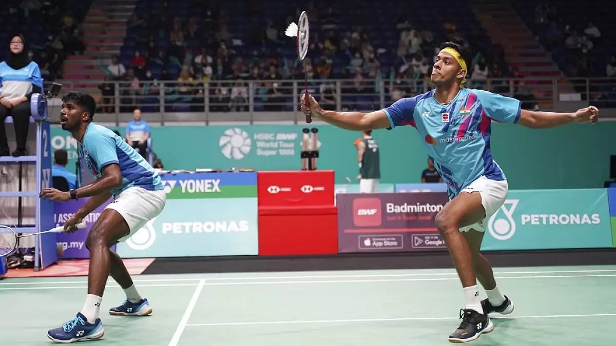 Chirag Shetty plays a shot as Rankireddy expectantly watches at the Malaysia Open on Friday.