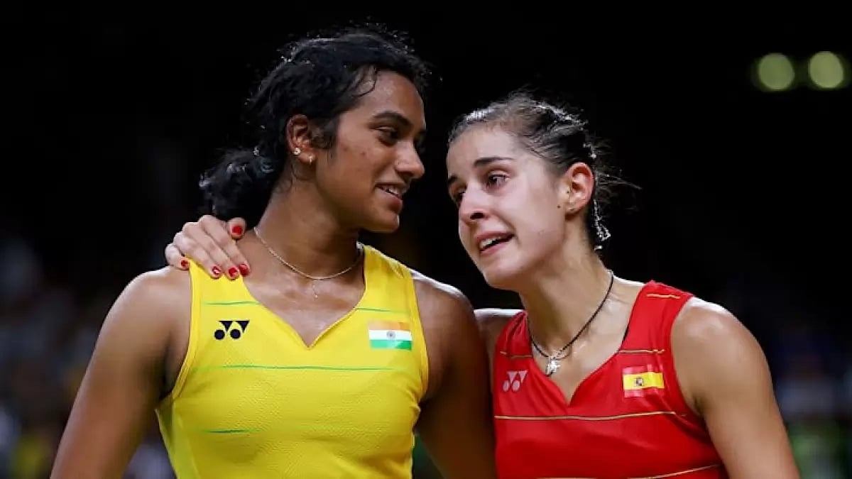 Carolina Marin with PV Sindhu.  - File Photo