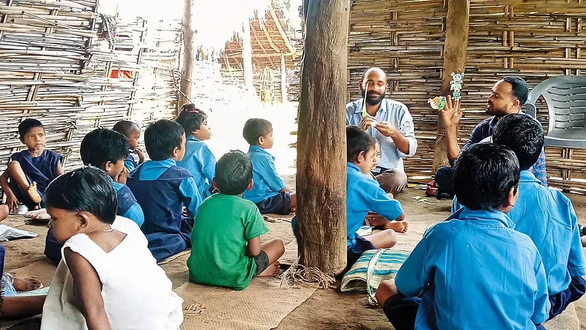 The author with a govt teacher in a school in Bathpath