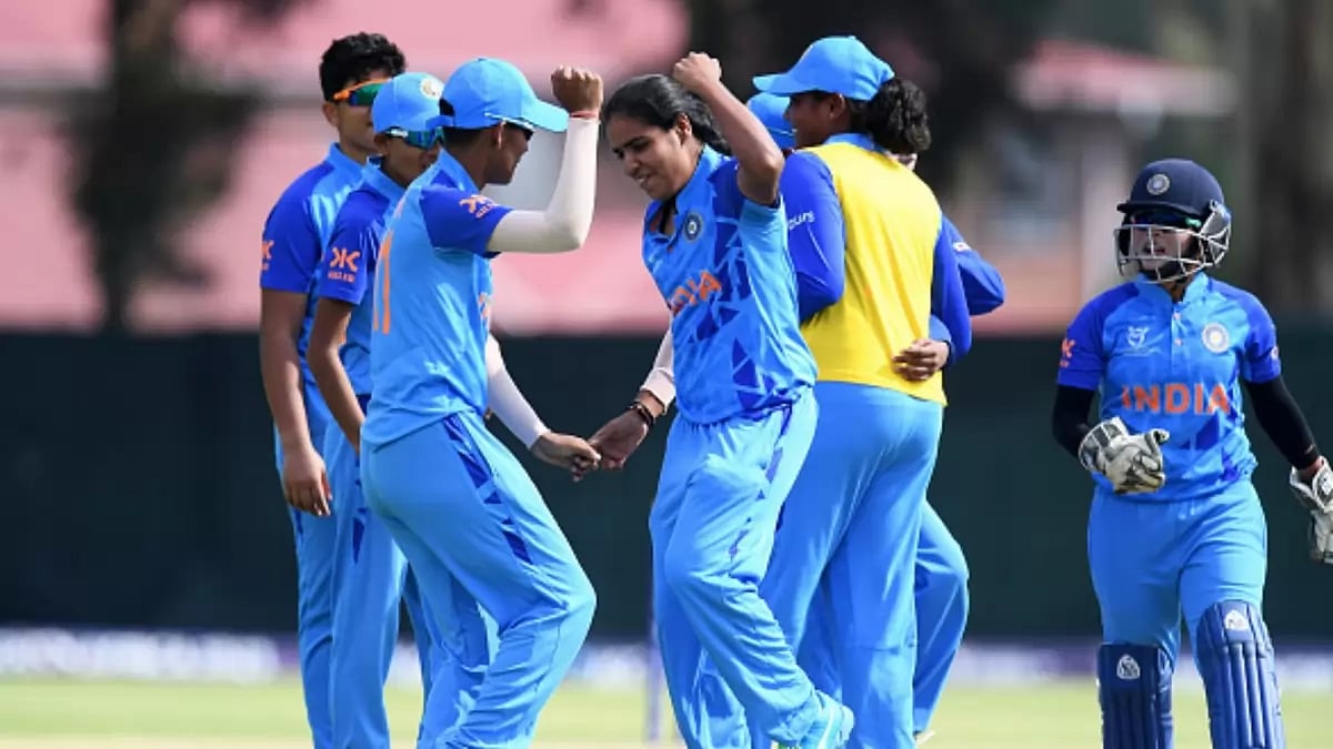 Mannat Kashyap, centre, celebrates a wicket against Scotland on Wednesday.
