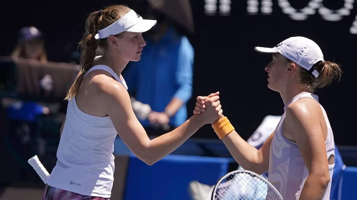 Swiatek, right, congratulates Rybakina on her win at the Australian Open on Sunday.