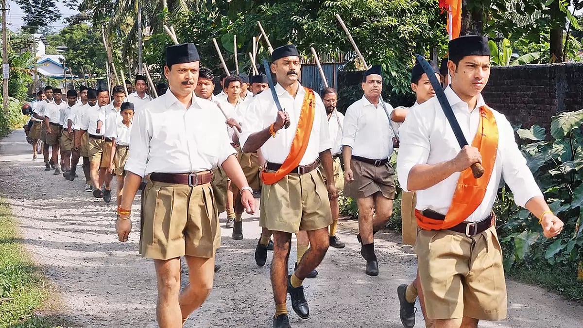 Marching Ahead: Volunteers march in Tezpur to mark the RSS foundation day