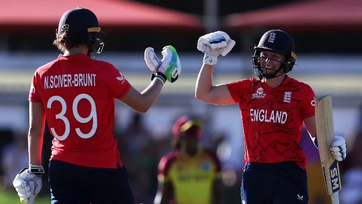 Heather Knight, right, and Nat Sciver-Brunt celebrate after defeating West Indies on Saturday.