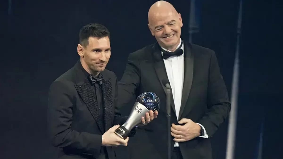 Lionel Messi receives the Best FIFA Mens player award from FIFA president Gianni Infantino.