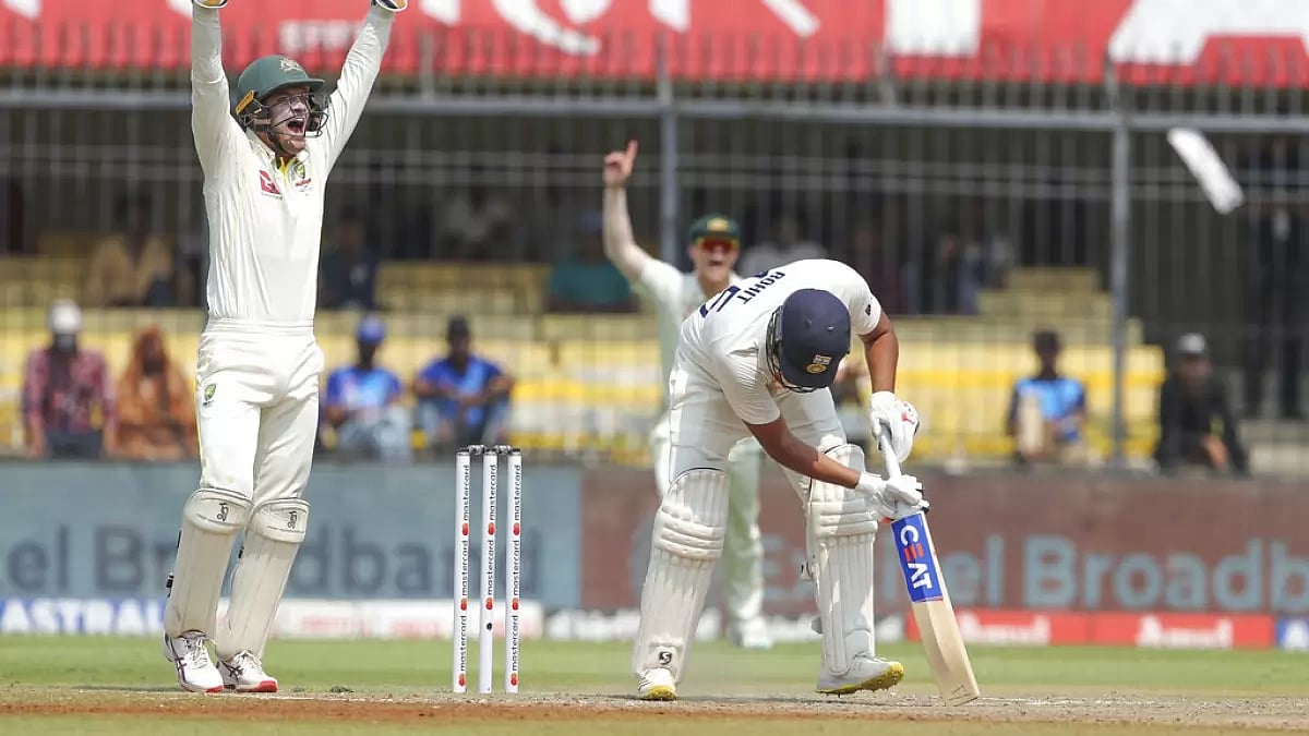 Australia players successfully appeal for an LBW against India captain Rohit Sharma.