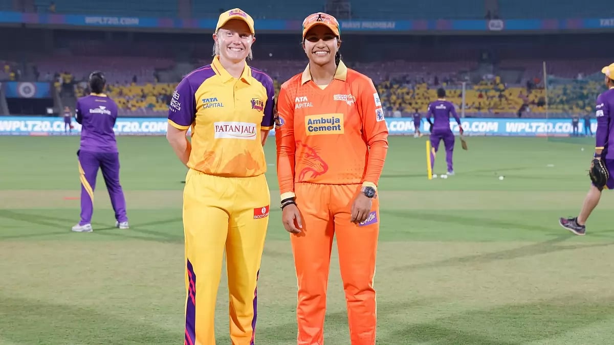 UP Warriorz's captain Healy, left, and Gujarat Giants' stand-in captain Sneh Rana at the toss.
