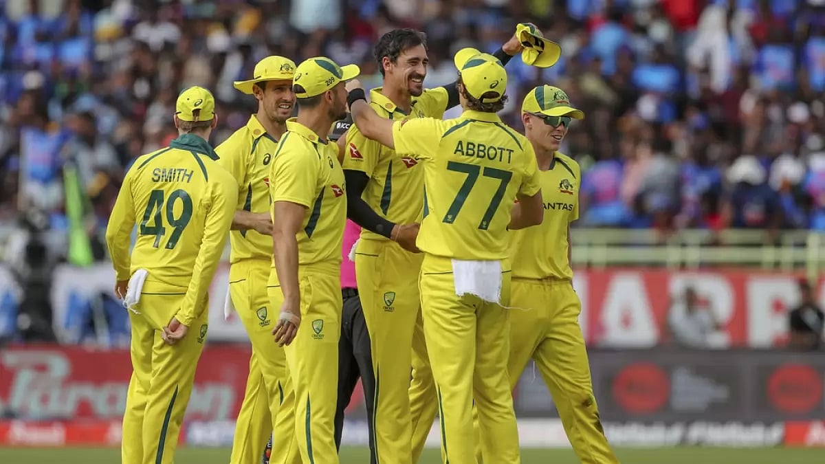 Australia players congratulate Starc on his fifth wicket against India on Sunday.