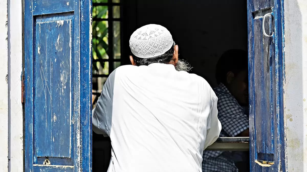 In or Out: Morigaon disrict of Assam, August 2019: a man checks for his name in the final published list of the NRC  