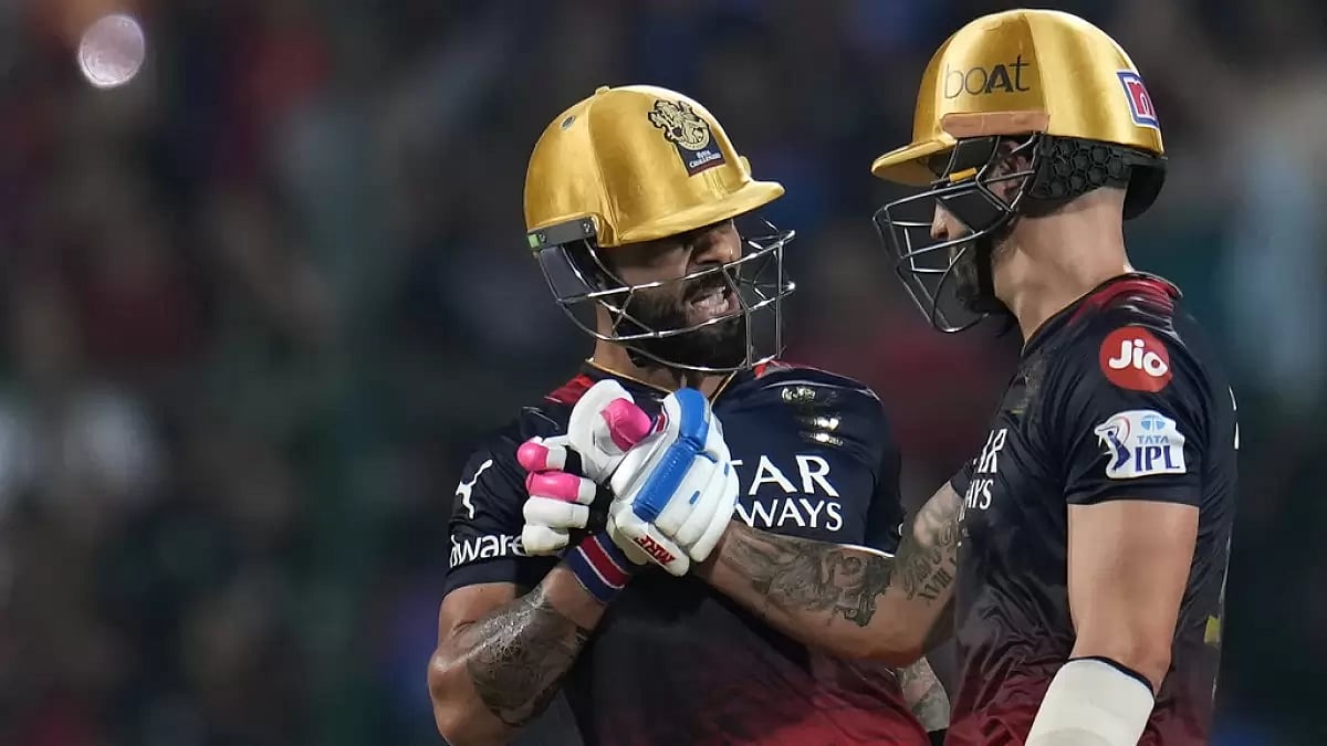 Faf du Plessis congratulates Virat Kohli on reaching his fifty against MI on Sunday. - null