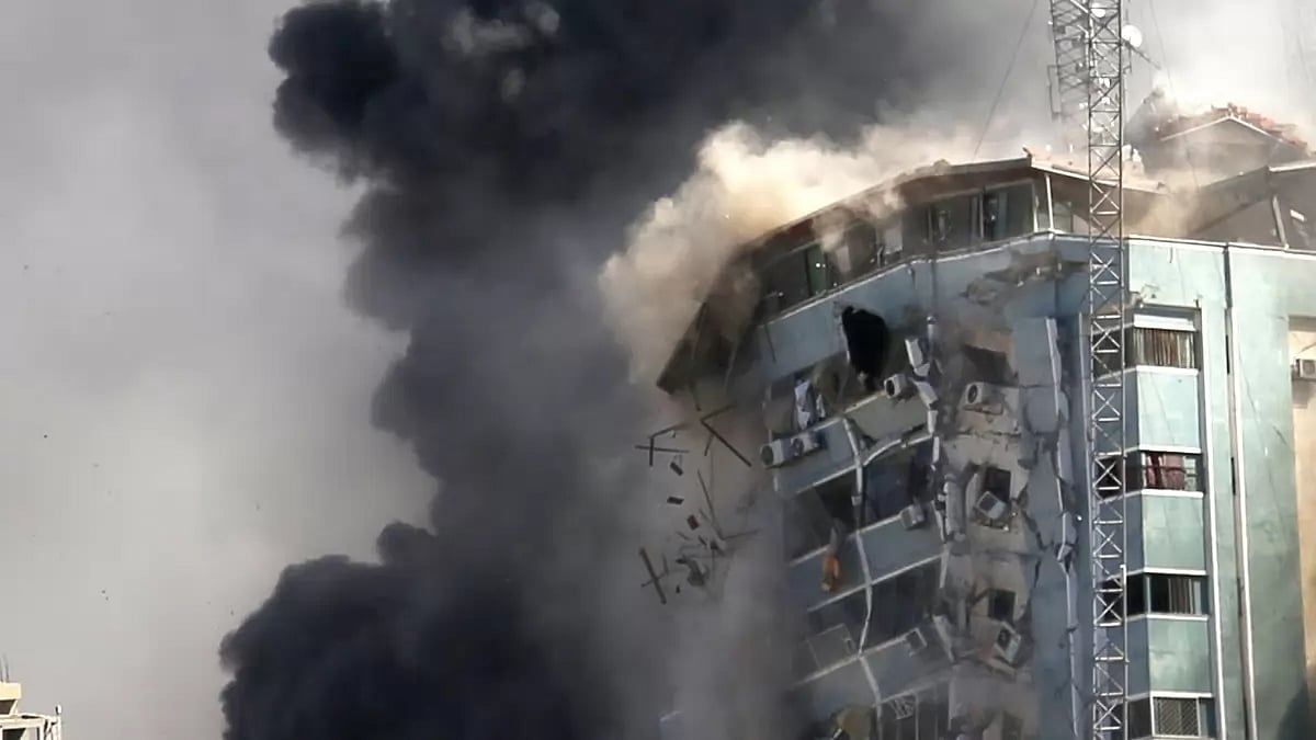Building collapsing after Israel launches attack on Gaza