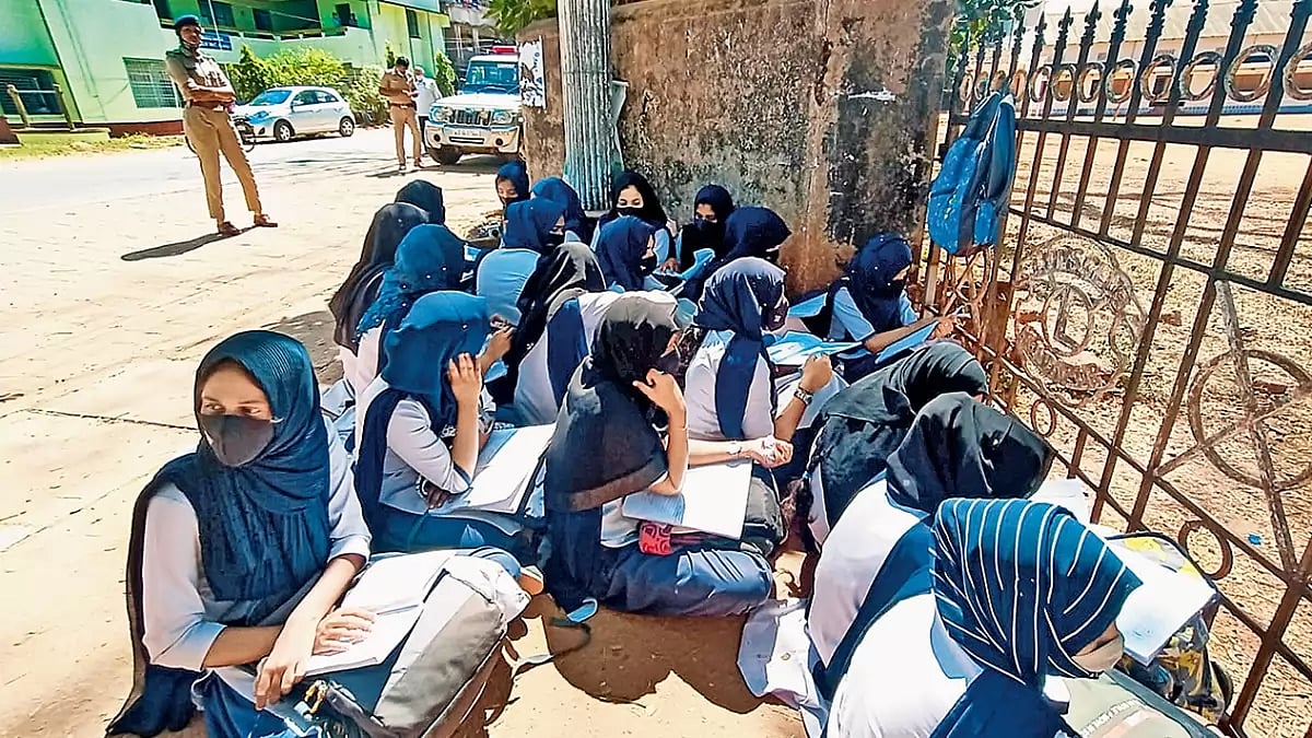 Students sitting outside after being denied entry for wearing the hijab, Kundapura, Udu