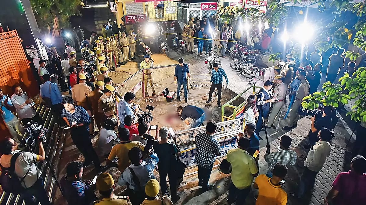 Cordoned Off: A team of forensics at the spot where Atiq Ahmed and his brother were shot dead while 