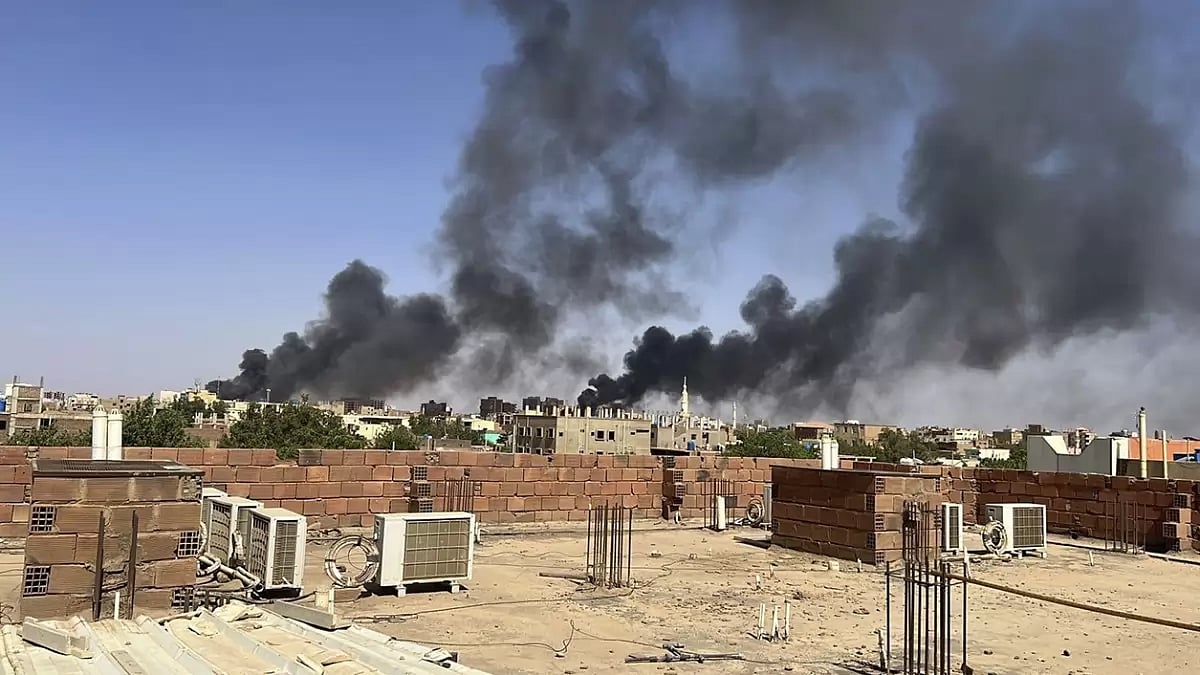 In this photo provided by Maheen S, smoke fills the sky in Khartoum, Sudan, near Doha International Hospital. The Muslim Eid al-Fitr holiday, typically filled with prayer, celebration and feasting — was a somber one in Sudan, as gunshots rang out across the capital of Khartoum and heavy smoke billowed over the skyline.