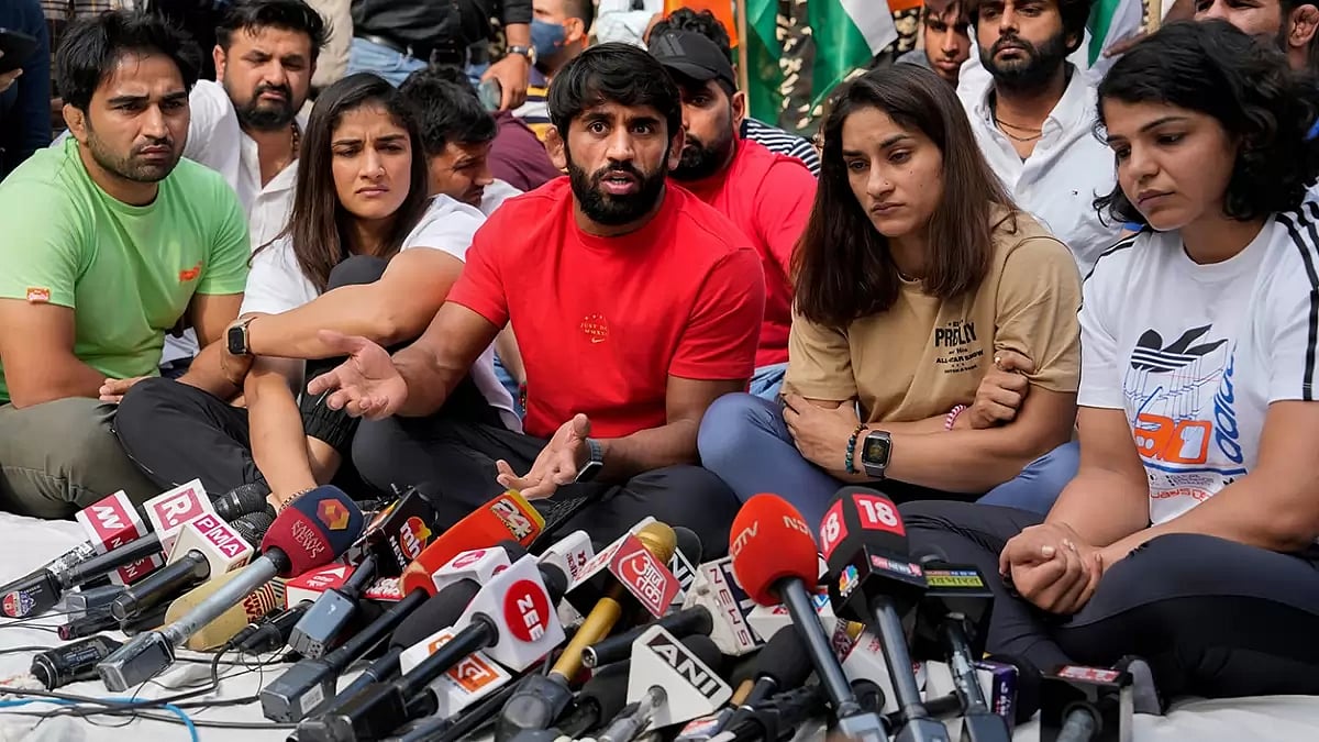 Wrestlers Bajrang Punia, Vinesh Phogat and Sakshi Malik during a press conference regarding wrestlers protest at Jantar Mantar, in New Delhi.