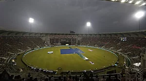 The pitch area is covered in sheets after rain stopped play in Lucknow on Wednesday.