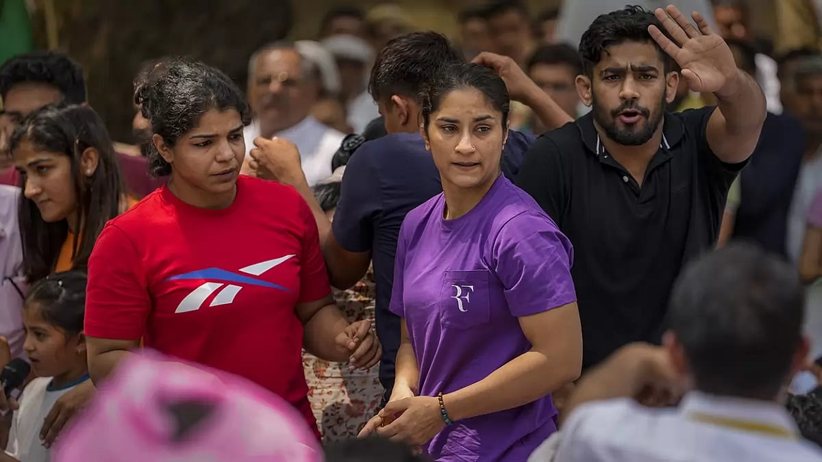Wrestlers Vinesh Phogat and Sakshi Malik with supporters during their protest.