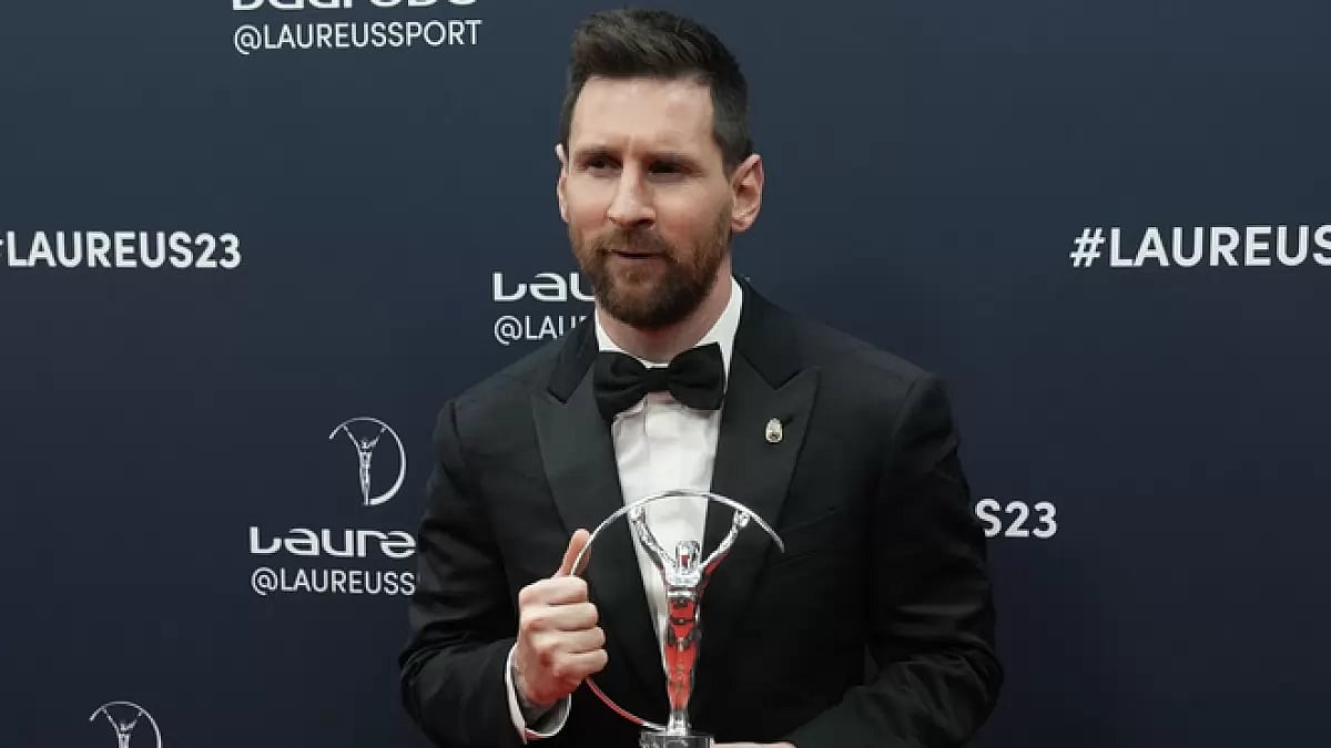 Lionel Messi poses after he was presented the award for sportsperson of the year.