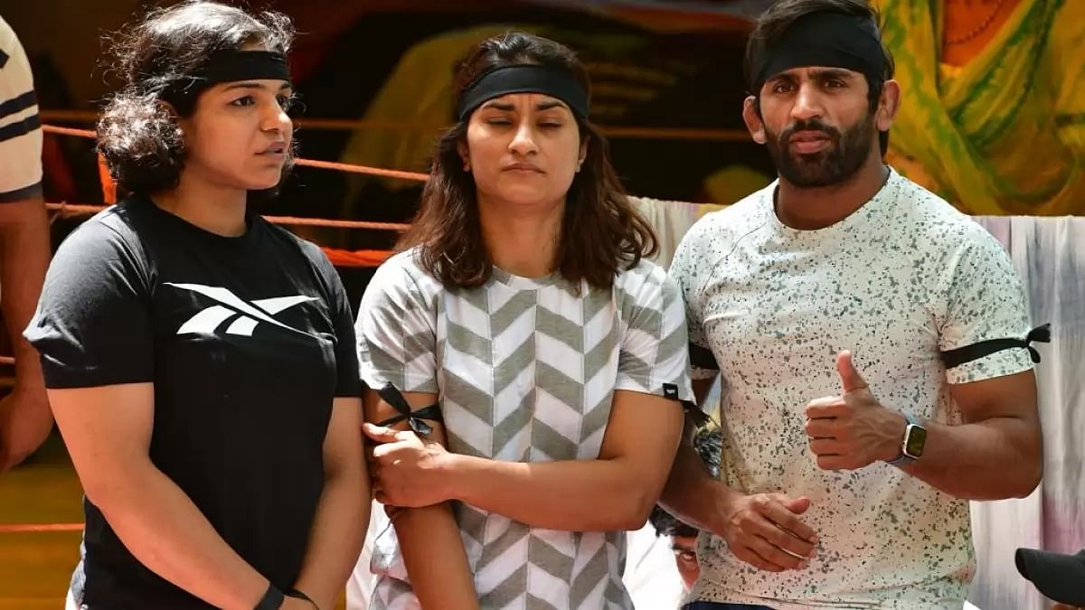 (L to R) Sakshi Malik, Vinesh Phogat and Bajrang Punia sport black bands to observe Black Day