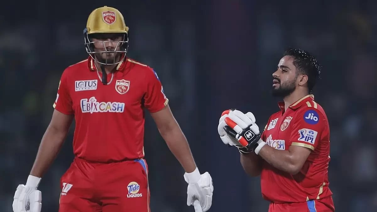 Prabhsimran celebrates after reaching his hundred ad Shahrukh Khan looks on.