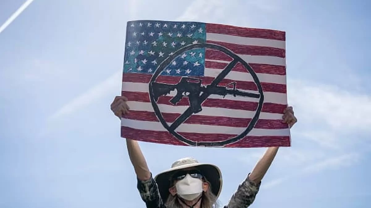 A protester holds up a sign during a rally against gun violence outside US Capitol.