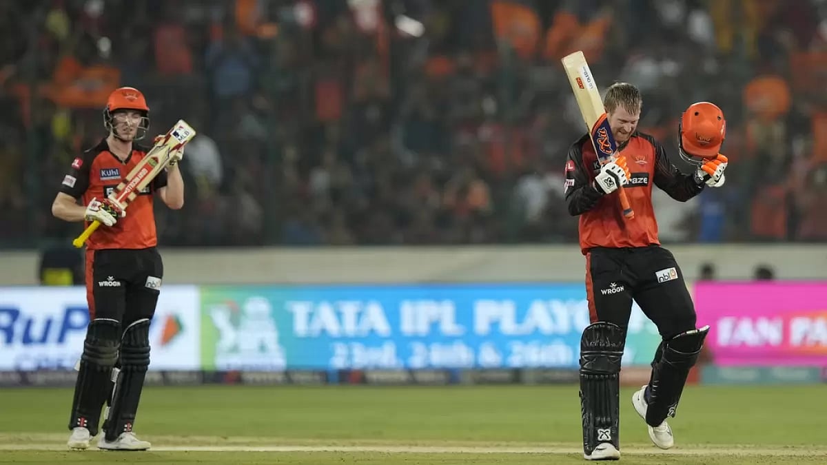 Klassen celebrates his hundred, as Harry Brook applauds in Hyderabad in Thursday.