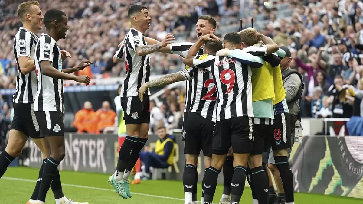 Newcastle players celebrate their team's opening goal against Brighton on Thursday.