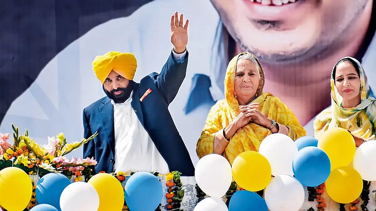 Victory Signs: Punjab chief minister Bhagwant Mann waves at his supporters