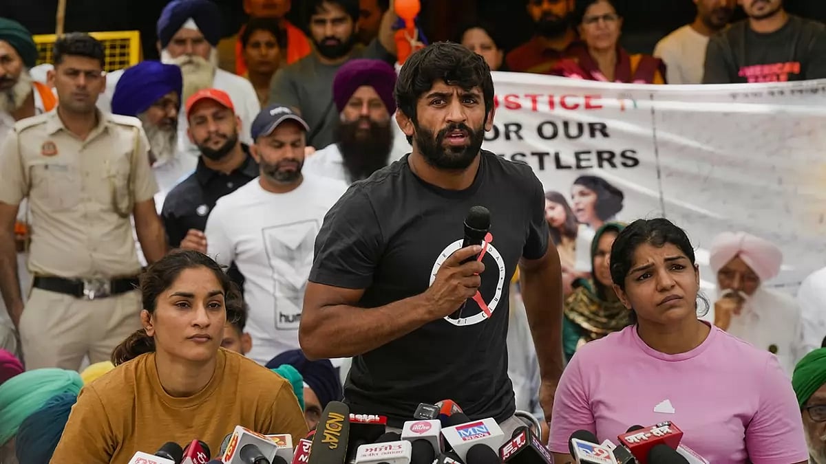 (File Photo)  : Indian wrestlers, Vinesh Phogat, Bajrang Punia and Sakshi Malik in a protest against the Wrestling Federation of India.