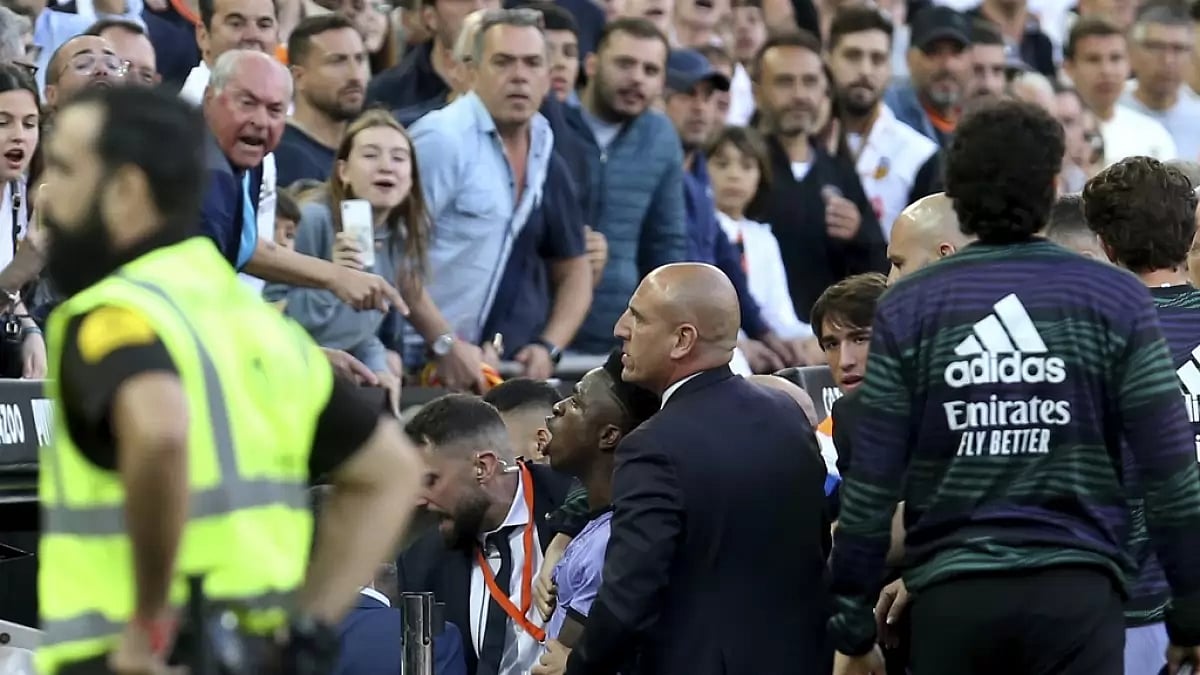 Vinicius, lower centre, confronts Valencia fans over their racist chants on Sunday.