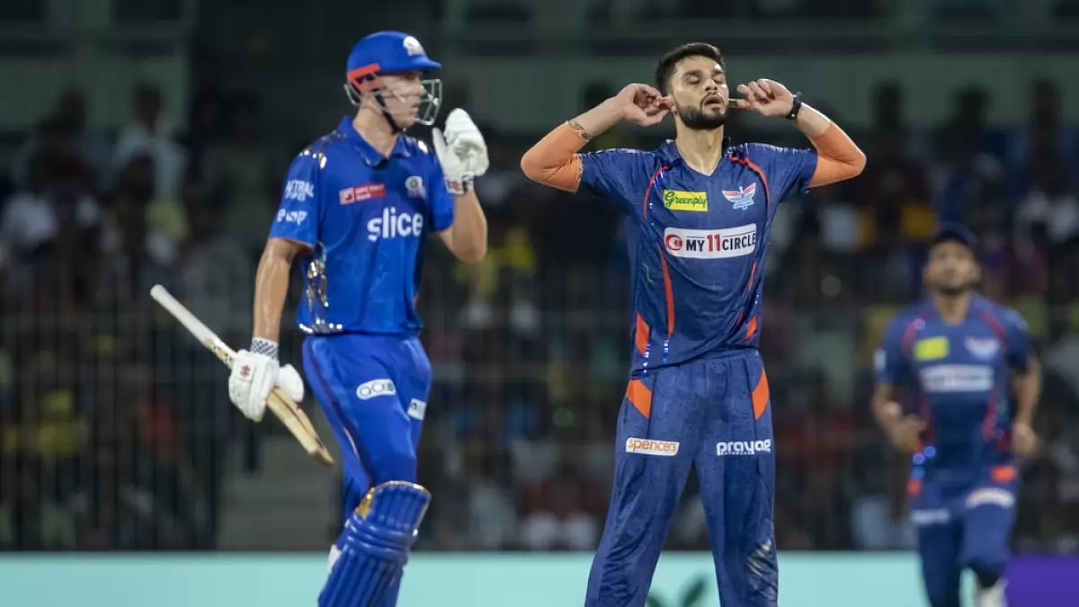 Naveen-ul-Haq celebrates a wicket of MI's Cameron Green during the Eliminator match.