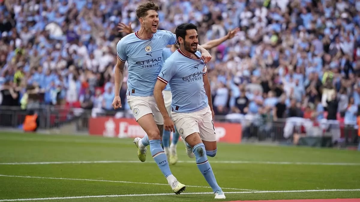 Gundogan, right, celebrates with team-mate John Stones after scoring a goal on Saturday.