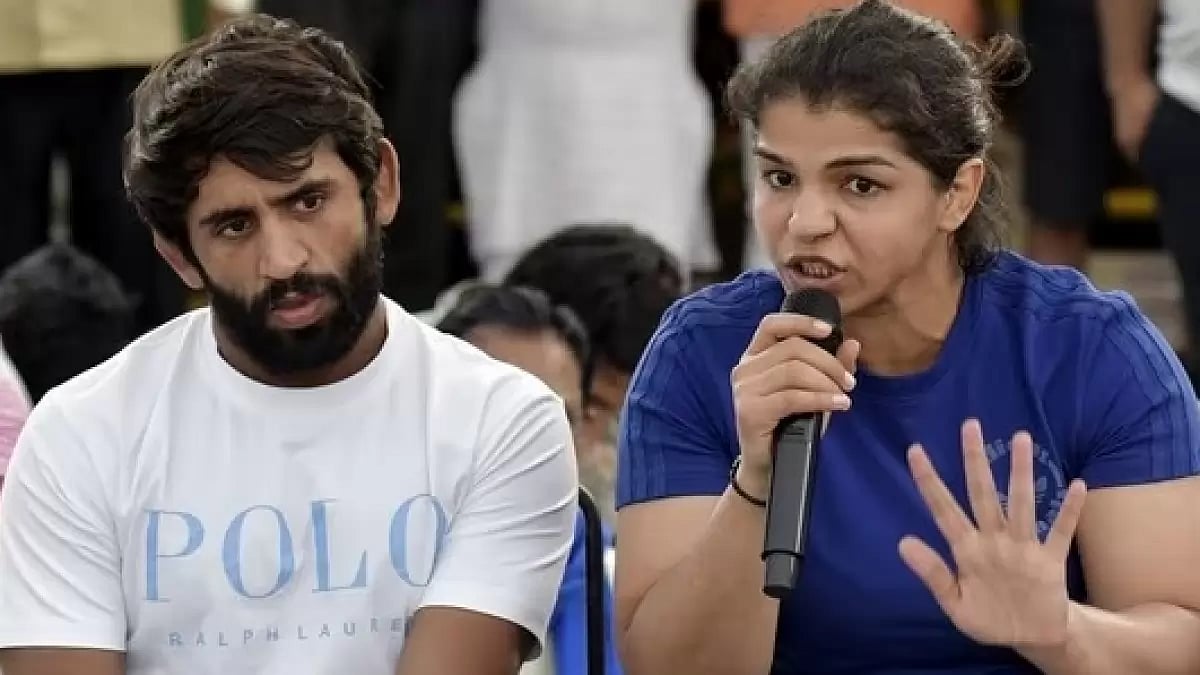 Wrestlers Sakshi Malik (R) and Bajrang Punia 