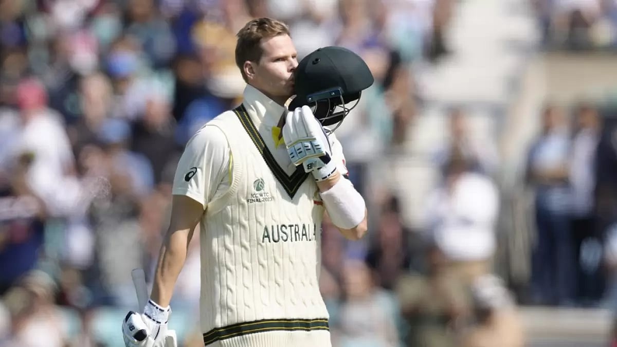 Steve Smith kisses his helmet as he celebrates his hundred against India on Thursday. - null