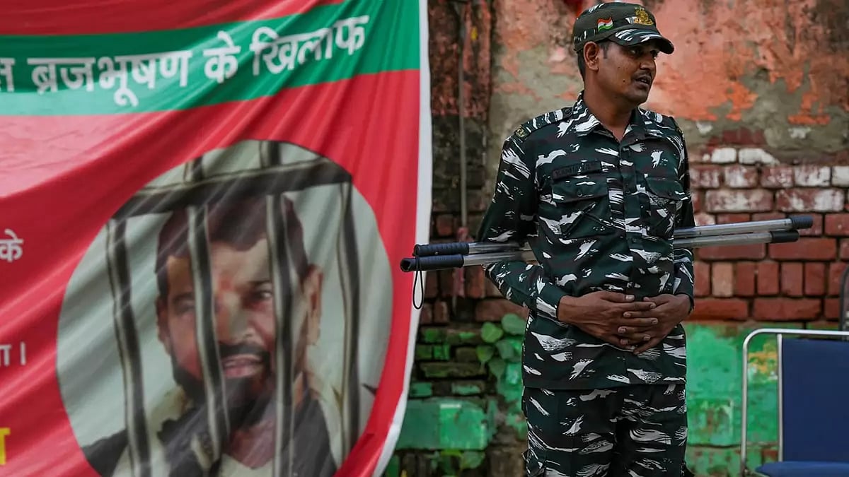 A security personnel guards during wrestlers' protest against Wrestling Federation of India (WFI) chief Brij Bhushan Sharan Singh, near Jantar Mantar in New Delhi.