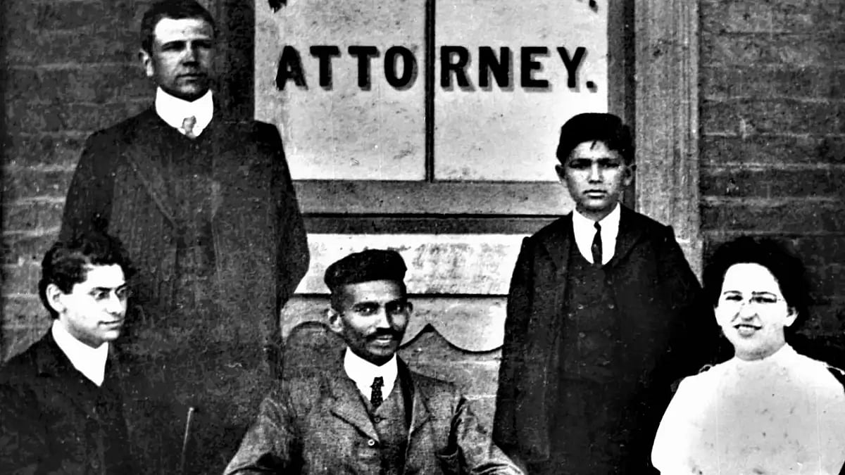 Mohandas Gandhi (center) sits with co-workers at his Johannesburg law office in 1902.(National Gandh