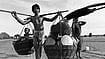 Examining Poverty In India How Poor is Poor?: An Adivasi family in search of work, seen here travelling with their child and belongings in Bastar, Chattisgarh, 1995