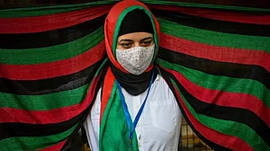 Afghans residing in India take part in a demonstration outside the UN Refugee Agency ( UNHCR) office in New Delhi on August 23, 2021 to protest against the Taliban's military takeover of Afghanistan.