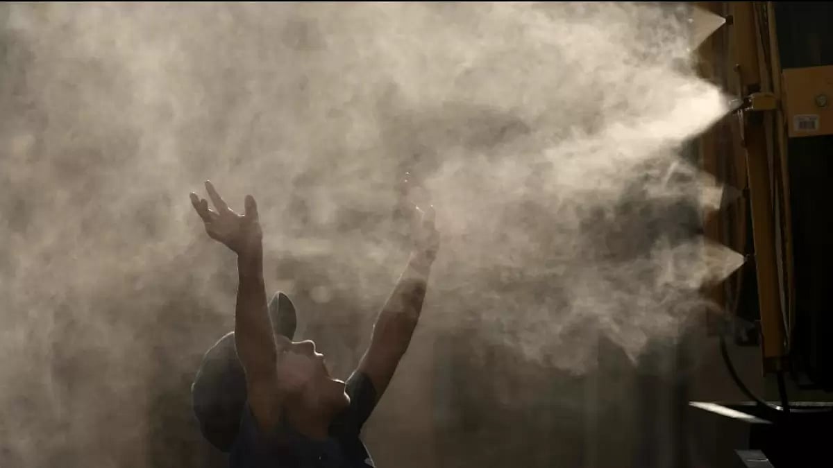 A young boy cools off as temperature approach degrees 100 degrees Fahrenheit in Kansas 