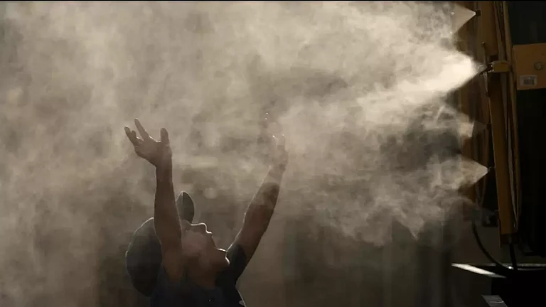 A young boy cools off as temperature approach degrees 100 degrees Fahrenheit in Kansas - null