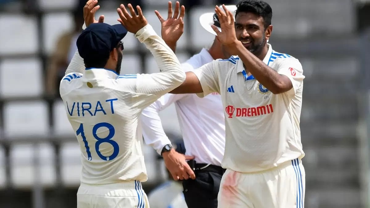 Ashwin celebrates a West Indies wicket with Virat Kohli.