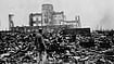 A survivor walks through the ruins of atomic-bombed Hiroshima in August 1945.