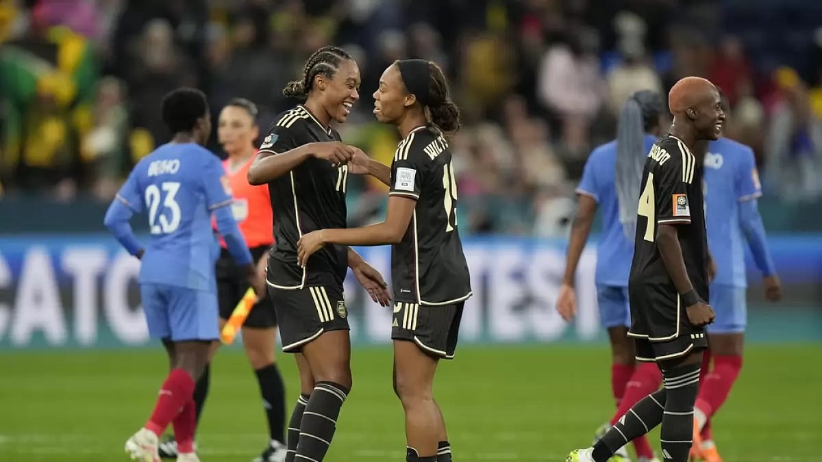 Jamaican players (left) celebrate their draw with France in the Womens World Cup tie.